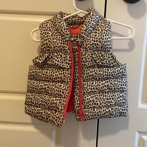 Leopard print puffy vest with pink zipper. NWT 0-6 mos.